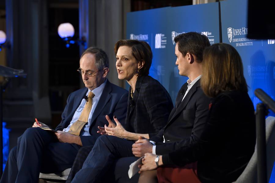 Anne Applebaum moderates a panel discussion with three other experts