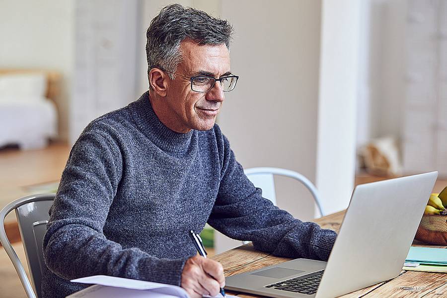 Man at home on computer