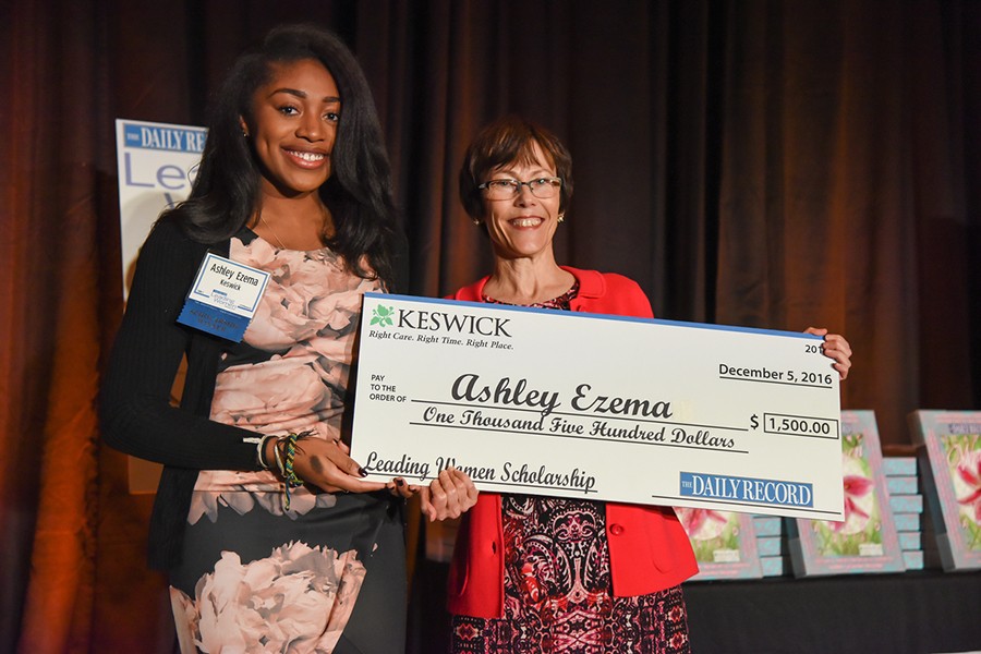 Ashley Ezema receives $1500 novelty check as scholarship recipient
