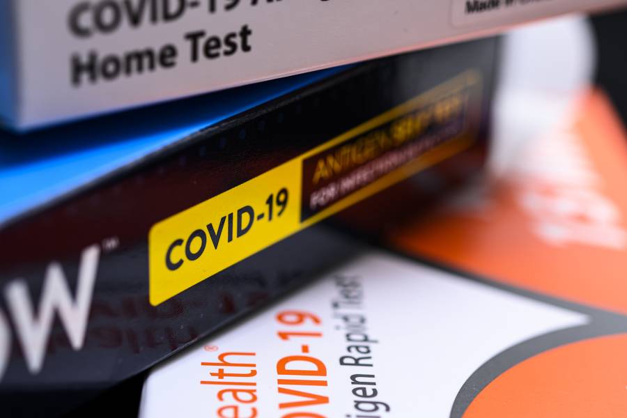 COVID-19 test kits arranged in a stack