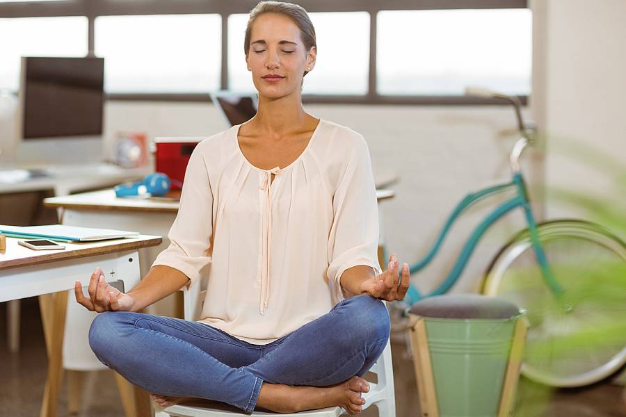 Woman doing chair yoga