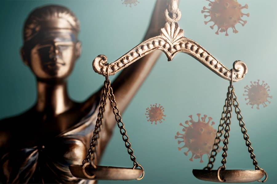 Lady Justice against a background of coronavirus particles