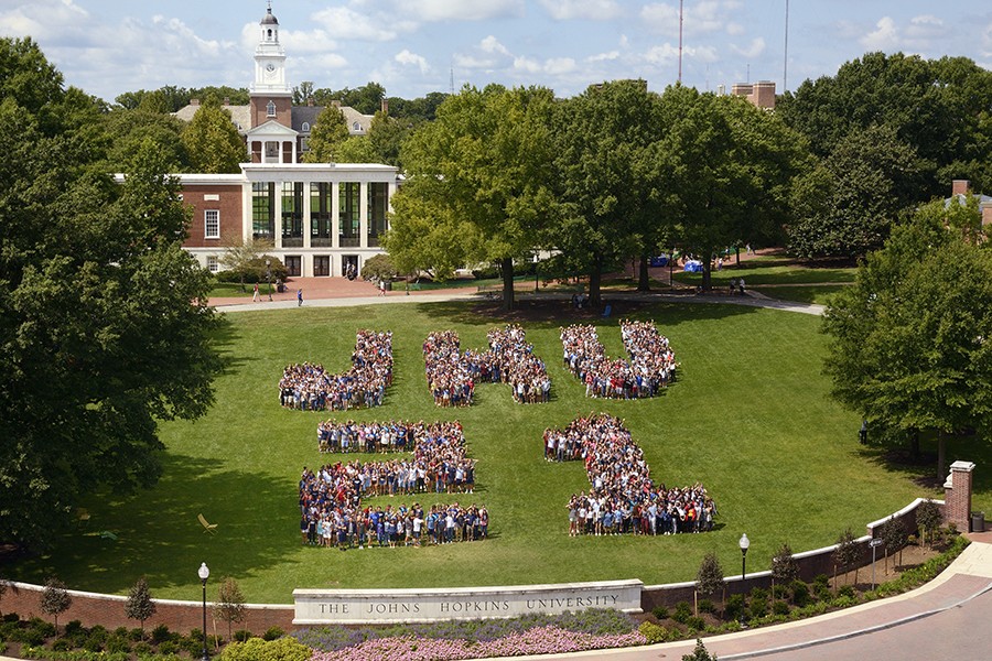 Students spell out 'JHU 21' on The Beach at Johns Hopkins University