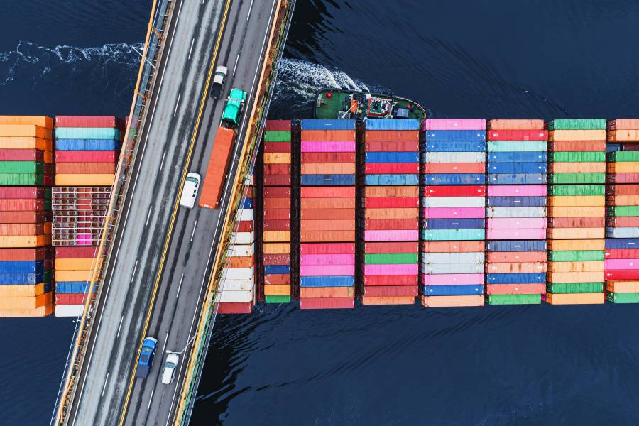 Arial view of a ship stacked with colorful shipping containers