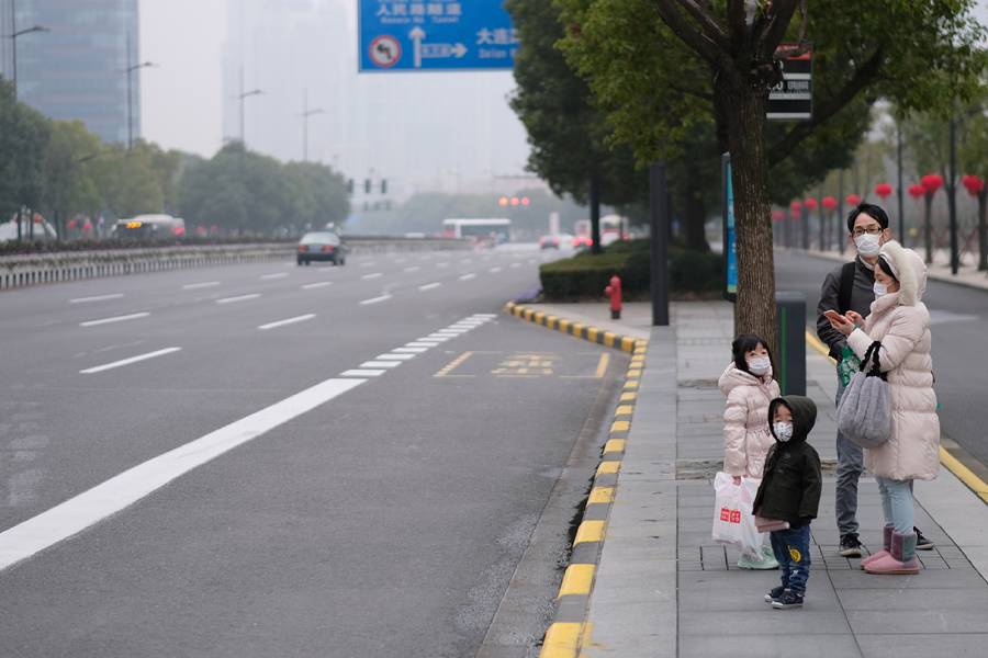 Family in Shanghai wears protective face masks