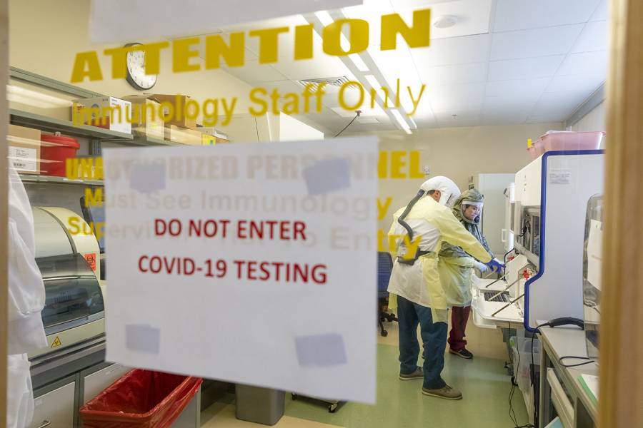 Sign on a lab door reads 'Do Not Enter: COVID-19 Testing'