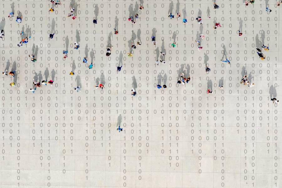 Overhead shot of crowd with binary code background