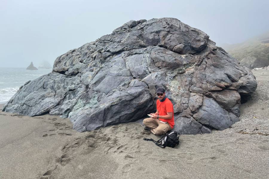 Daniel Viete next to a rock formation in California