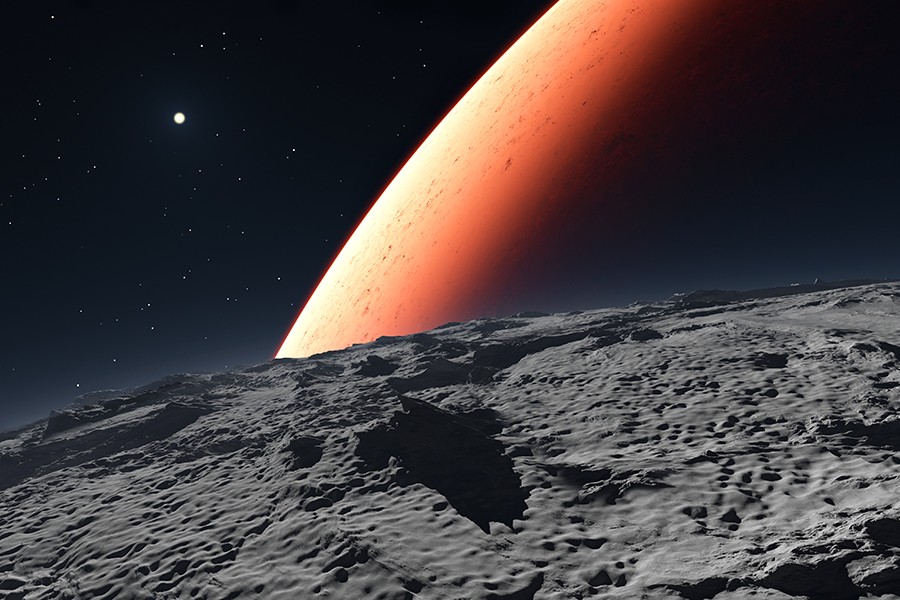 Red planet seen from rocky surface of moon