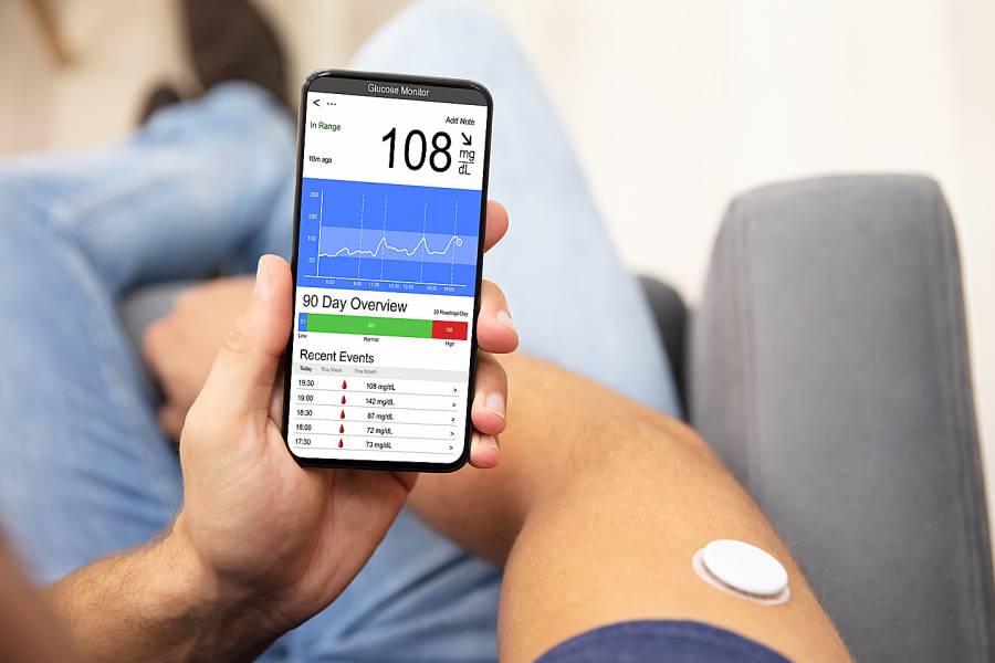 Man checking blood sugar level on smart phone