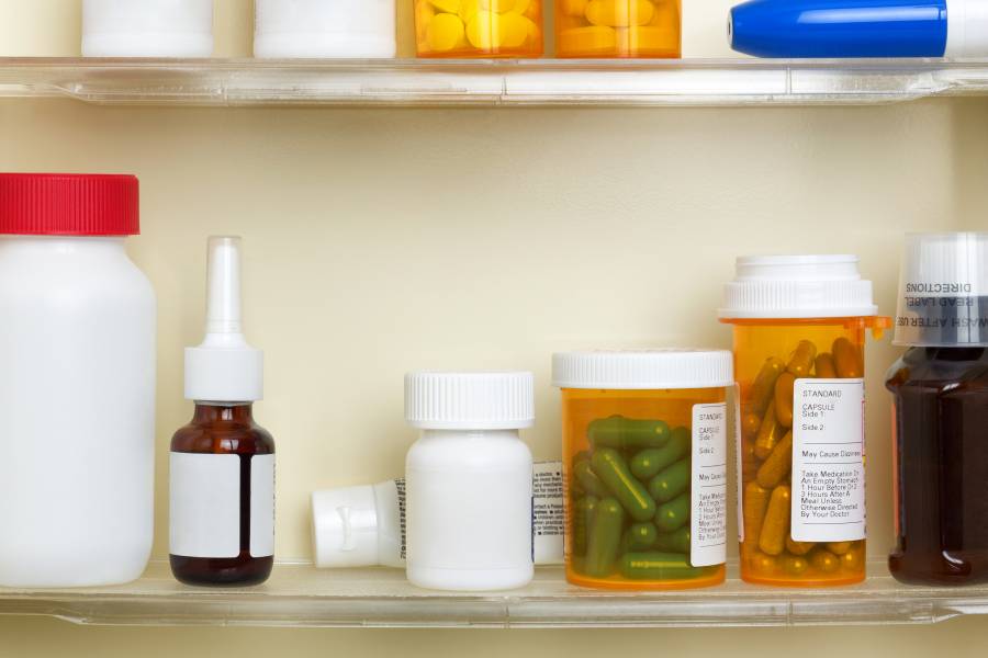 Prescription bottles in a medicine cabinet