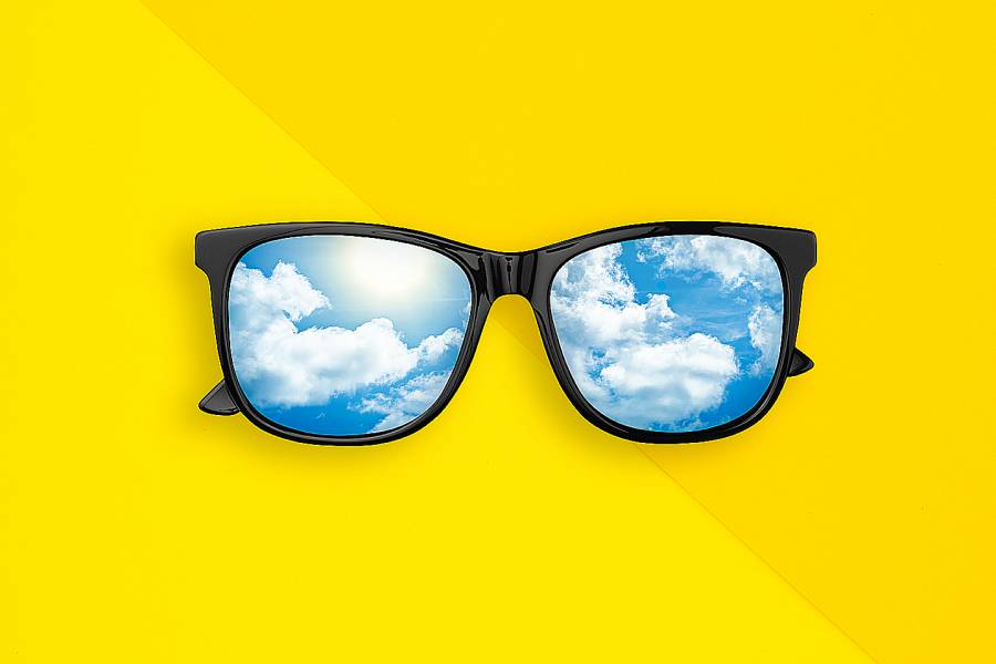 Illustration of large-framed glasses with lenses reflecting clouds