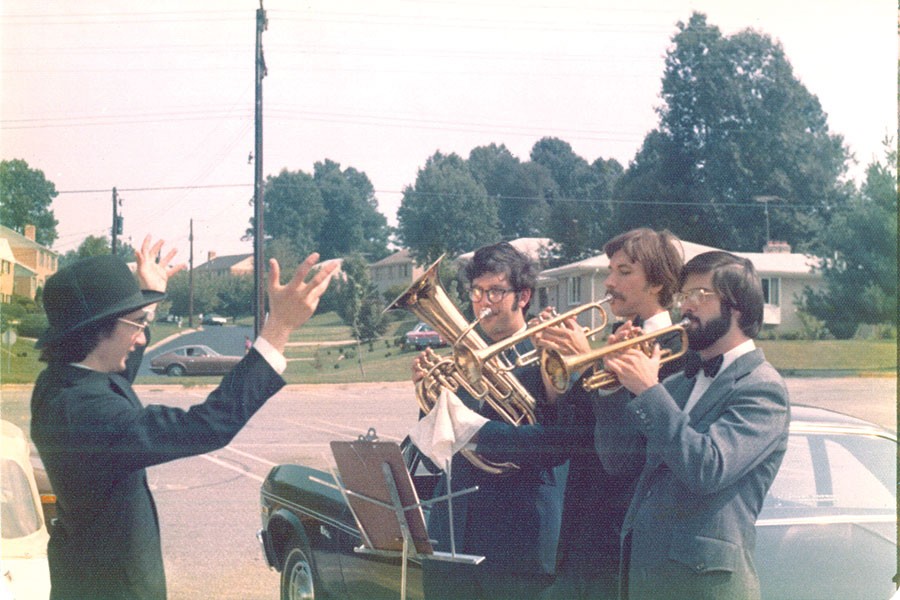 Mark Goldstein, A&S ’73, Peab ’75, conducts the brass trio, which includes Alan Lane, A&S ’73.