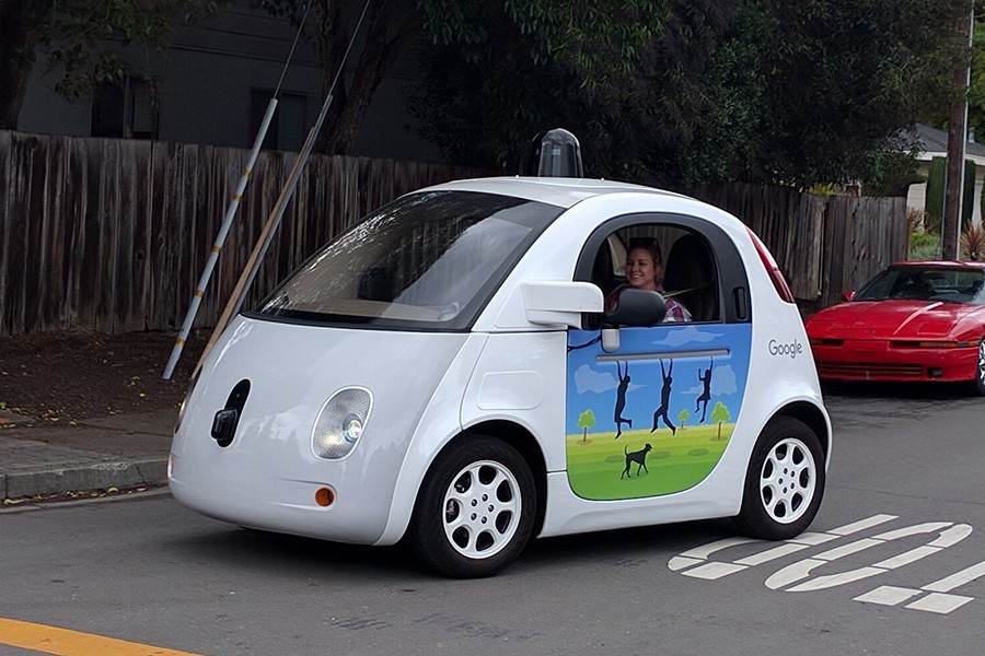 A woman sits in a Google self-driving car