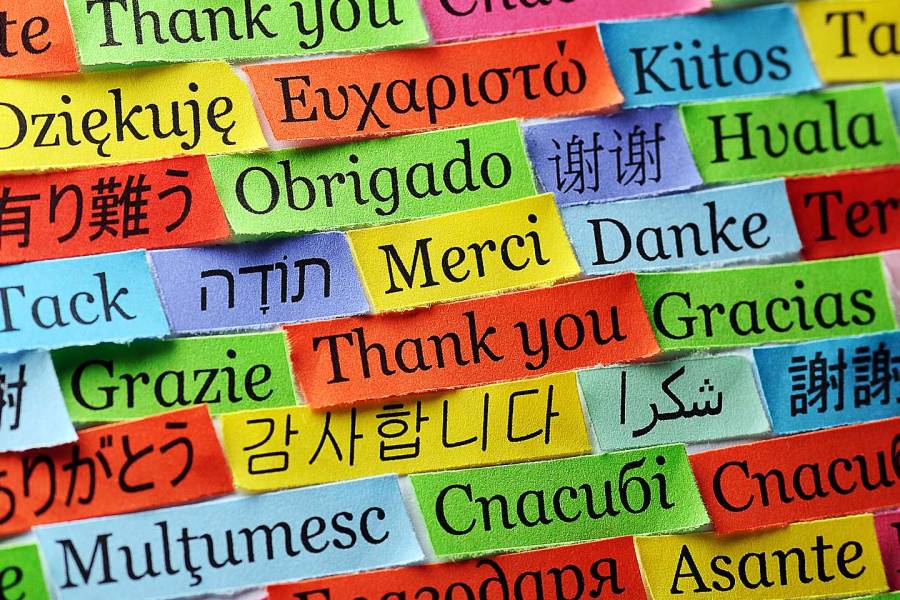 Colorful strips of ribbon with the phrase thank you written in many different languages