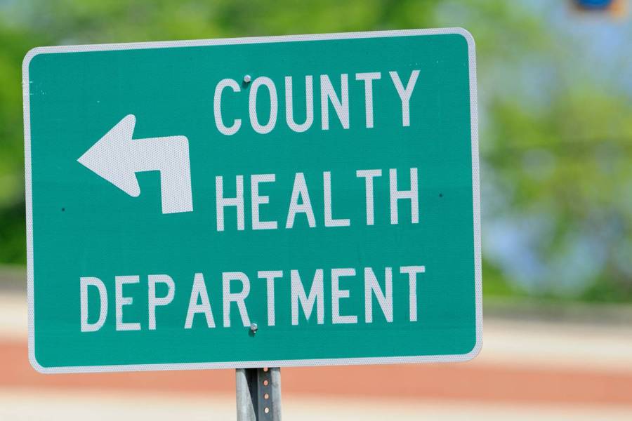 Traffic sign points to county health department