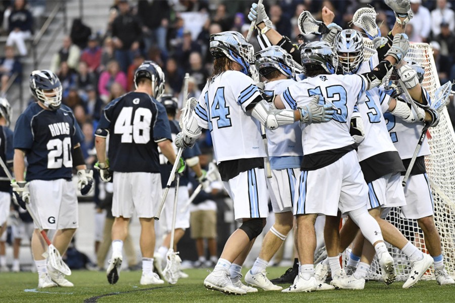 Hopkins players celebrate game-winning goal in overtime