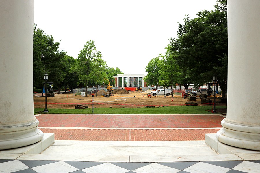 Image of sod and exposed dirt on Keyser Quad, with MSE Library in the background