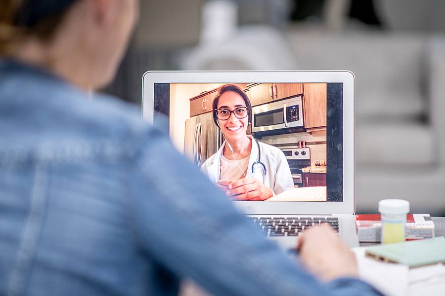 Woman having televisit with a doctor