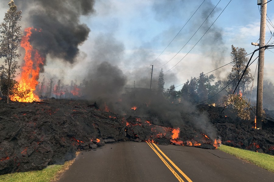 Lava overtakes a road