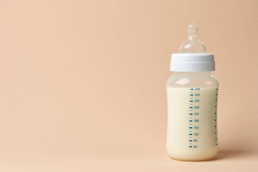 A bottle full of infant formula