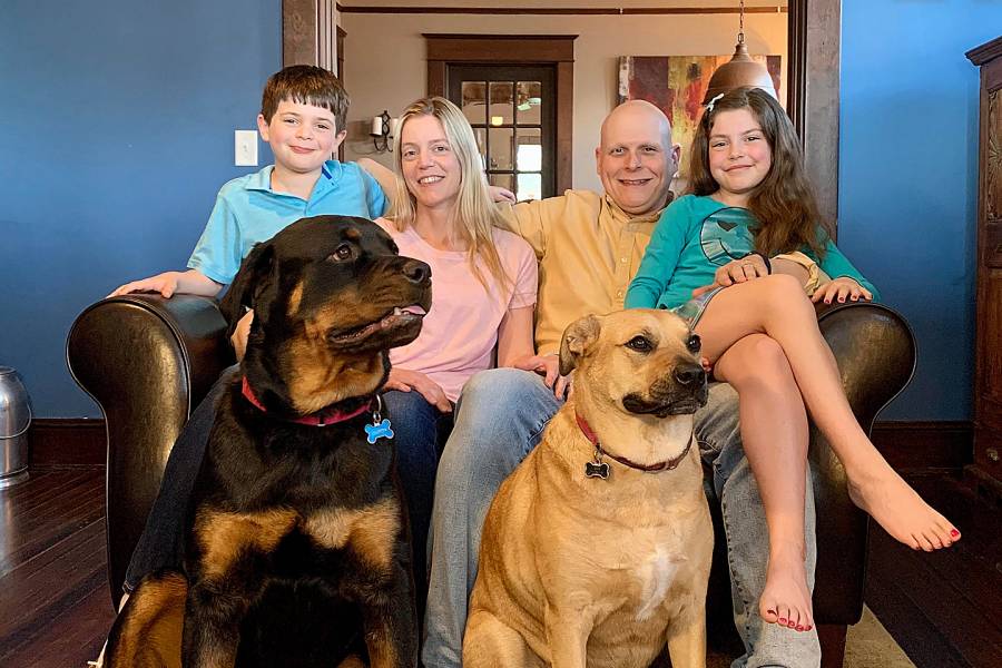 The Montcalmo family—Luca, Rebekah, Joseph, and Juliet—at home with their dogs Dutch and Sami