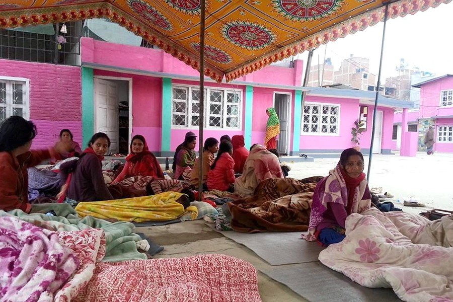 Women gather under a tent in Nepal