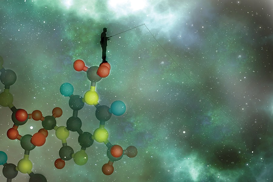 An abstract illustration shows a man fishing in the universe while standing on atoms