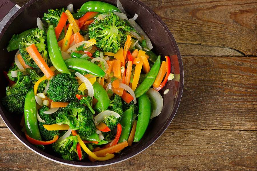 Overhead view of a vegetable stir-fry in a wok