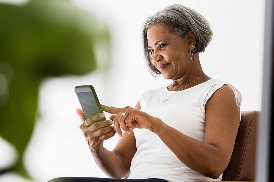 Woman using an app on her mobile phone
