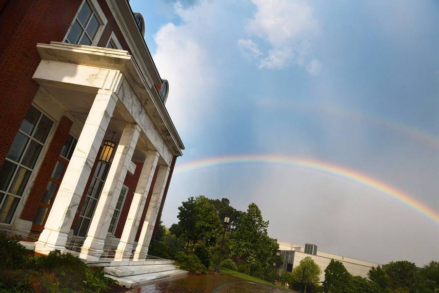 A rainbow appears over Mason Hall