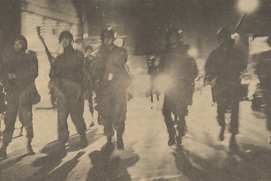 Yellowed newspaper clipping of riot police
