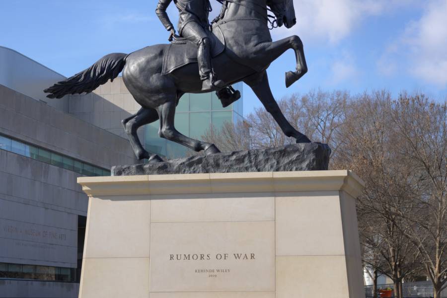 Photograph of a statue of a Black man astride a horse in the style of Confederate memorial statues