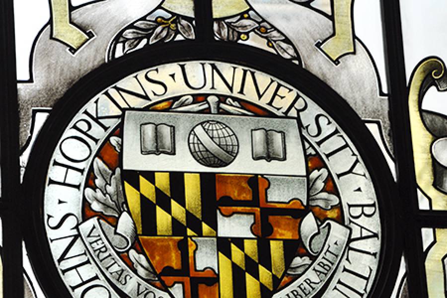 Stained glass image of university seal 