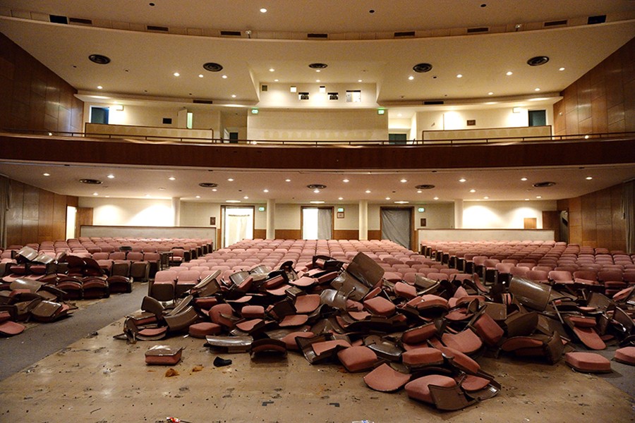 Auditorium chairs are piled up during early stages of the renovation project