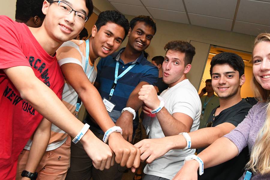 Group of students show off wearable tech device Aura Spark