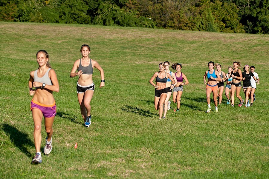 Felicia Koerner leads the pack at a training run at Druid Hill Park.