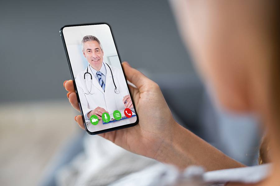 Smartphone screen showing image of a doctor