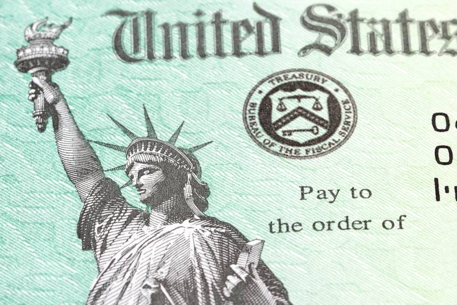 Close-up photograph of a stimulus check with Lady Liberty on it