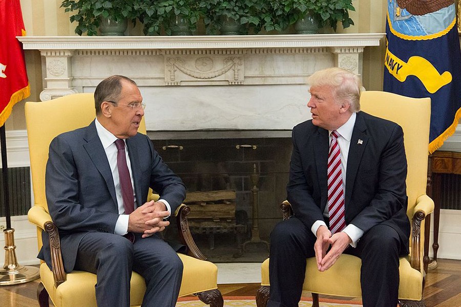 Seated on chairs in the Oval Office, Trump and Lavrov chat