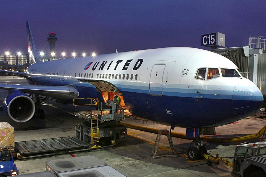 United Boeing 767-300 at gate at Chicago O'Hare International Airport under night sky