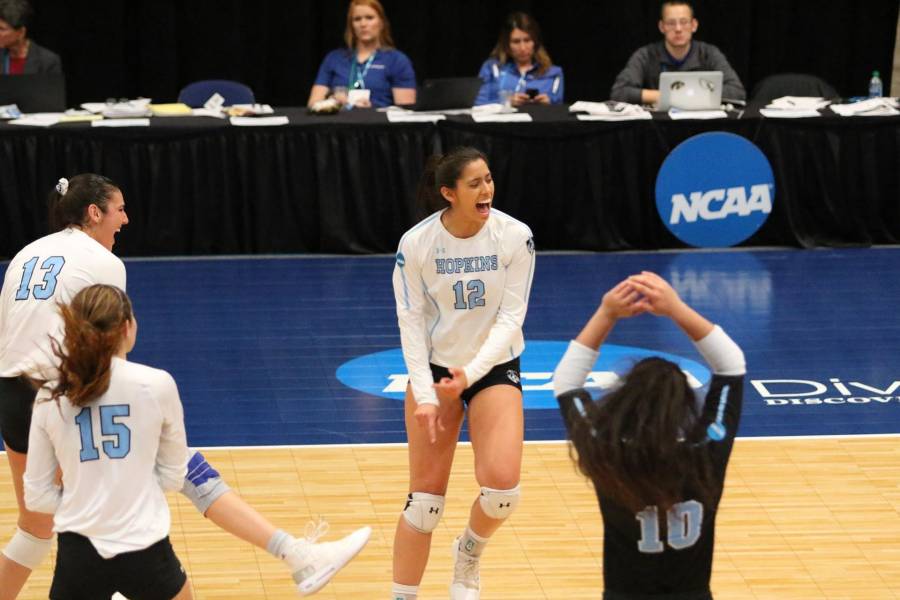 Johns Hopkins volleyball players celebrate a point win