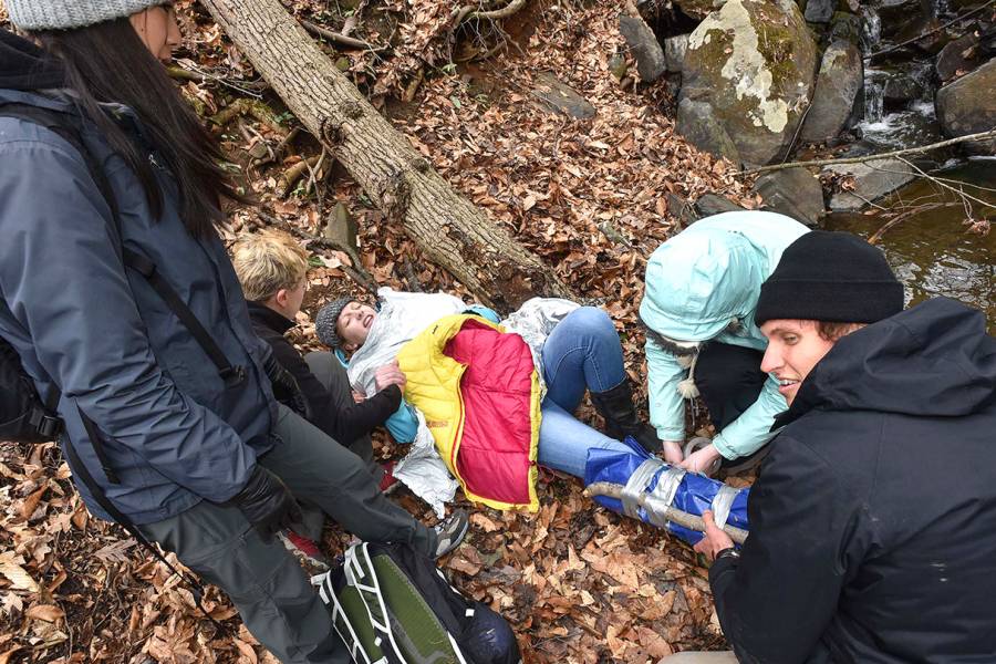 Students tend to a fallen hiker as part of JHU's Austere Medicine/Wilderness Medicine course