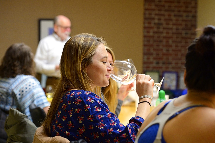 Student sips wine