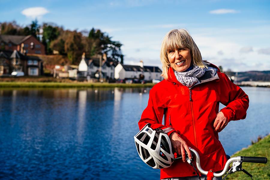 Happy senior woman with bicycle