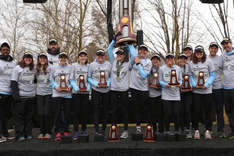 Johns Hopkins women's cross country team with NCAA championship trophy