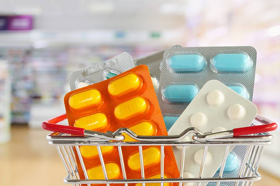 Oversized packs of pills in a shopping cart