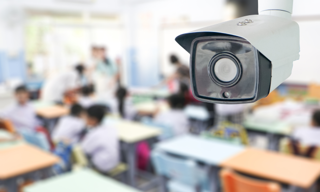A surveillance camera seen in a school classroom