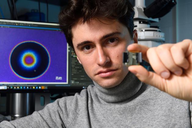 Johns Hopkins physics doctoral student Alvin Modin in the lab