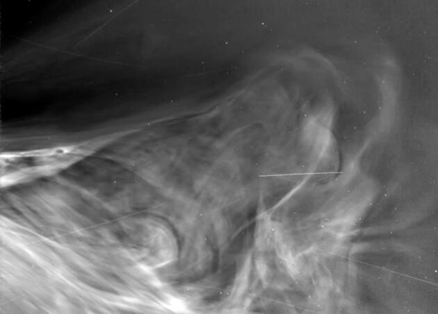Black and white image of waves of solar wind